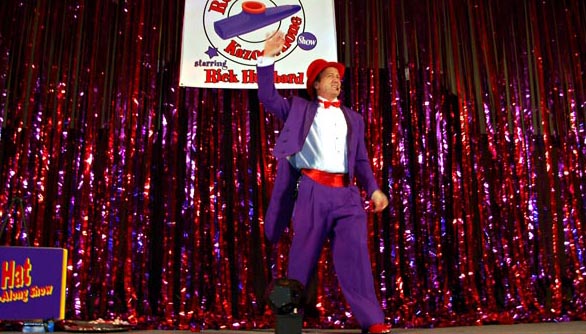 Rick Hubbard on stage in the Top Hat Kazoo-Along Show